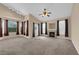Spacious living room featuring a fireplace, large windows, and vaulted ceilings at 10550 W Alexander Rd # 2233, Las Vegas, NV 89129