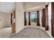 Cozy living area with large bay windows and neutral carpeting at 10550 W Alexander Rd # 2233, Las Vegas, NV 89129