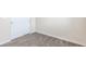 Carpeted bedroom featuring white walls, baseboards and a closet, providing a blank canvas for personal style at 10777 Briset Ct, Las Vegas, NV 89166