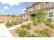 Well-maintained home featuring a landscaped front yard with walkway and desert plants at 10777 Briset Ct, Las Vegas, NV 89166
