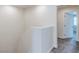 This hallway features neutral walls and carpet flooring at 10777 Briset Ct, Las Vegas, NV 89166