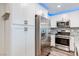This kitchen features stainless steel appliances, recessed lighting and shaker style cabinets at 10777 Briset Ct, Las Vegas, NV 89166