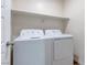 Laundry room with stacked appliances, offering functionality and convenience for everyday chores at 10777 Briset Ct, Las Vegas, NV 89166