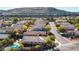 View of a well-maintained neighborhood, featuring landscaped homes and proximity to the mountains at 11132 Ferragamo Ct, Las Vegas, NV 89141