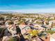 Gorgeous aerial shot showcasing the home's desert landscaping, mountain views, blue skies, and proximity to community amenities at 11132 Ferragamo Ct, Las Vegas, NV 89141