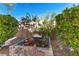 Tranquil backyard with green foliage and a garden bed at 11132 Ferragamo Ct, Las Vegas, NV 89141