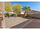 Spacious backyard featuring a patio area, a gazebo, desert landscaping, and block wall fencing at 11132 Ferragamo Ct, Las Vegas, NV 89141
