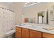 Bright bathroom with large vanity, mirror, and tub-shower combo at 11132 Ferragamo Ct, Las Vegas, NV 89141