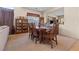 Open concept dining area featuring a full-sized table and chairs, and natural light through windows at 11132 Ferragamo Ct, Las Vegas, NV 89141