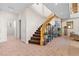 Bright foyer boasts tile flooring and a staircase with wood railings, providing an inviting entrance to the home at 11132 Ferragamo Ct, Las Vegas, NV 89141
