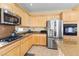 Well-lit kitchen features stainless steel appliances and granite countertops at 11132 Ferragamo Ct, Las Vegas, NV 89141