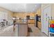 Spacious kitchen with an island, stainless steel appliances, granite countertops, and ample cabinet space at 11132 Ferragamo Ct, Las Vegas, NV 89141
