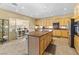 Modern kitchen boasts a large island, stainless steel appliances, and ample counter space for cooking and entertaining at 11132 Ferragamo Ct, Las Vegas, NV 89141