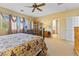 Inviting main bedroom with plush carpeting, natural light, neutral paint, and furniture at 11132 Ferragamo Ct, Las Vegas, NV 89141