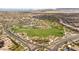 Aerial view of community park and recreation area with homes and schools nearby at 12048 Portamento Ct, Las Vegas, NV 89138