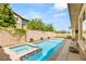 Relaxing backyard boasts a refreshing pool and spa, perfect for outdoor entertaining at 12048 Portamento Ct, Las Vegas, NV 89138