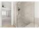 Modern bathroom boasts a glass-enclosed shower with gray tiling and a built-in bench at 12048 Portamento Ct, Las Vegas, NV 89138