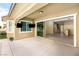 Spacious covered patio features a large sliding glass door seamlessly connecting indoor and outdoor living at 12048 Portamento Ct, Las Vegas, NV 89138