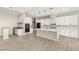 Bright kitchen with a large island, stainless steel appliances, and wood-style flooring at 12048 Portamento Ct, Las Vegas, NV 89138