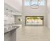 Open living area with backyard access, and an adjacent gourmet kitchen, perfect for entertaining guests at 12048 Portamento Ct, Las Vegas, NV 89138