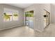 Living room with sliding glass doors opening to the backyard pool area at 12048 Portamento Ct, Las Vegas, NV 89138