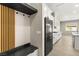 Mudroom with storage, shelving, and direct access to the kitchen at 12048 Portamento Ct, Las Vegas, NV 89138