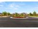 Street view of roundabout featuring beautiful landscaping and mountain views at 12048 Portamento Ct, Las Vegas, NV 89138