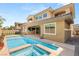 Beautiful backyard featuring a pool and spa, perfect for outdoor relaxation and entertainment at 12048 Portamento Ct, Las Vegas, NV 89138