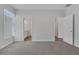 Spacious bedroom with multiple doors, neutral carpet, and ample natural light at 1213 Star Meadow Dr, North Las Vegas, NV 89030