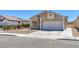 Single-Gathering home with a two-car garage and desert landscaping at 1213 Star Meadow Dr, North Las Vegas, NV 89030