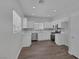 Bright kitchen features stainless appliances, white cabinets, and a stylish backsplash at 1213 Star Meadow Dr, North Las Vegas, NV 89030
