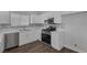 Modern kitchen featuring white cabinets, stainless steel appliances, and updated backsplash at 1213 Star Meadow Dr, North Las Vegas, NV 89030