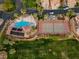 A wide aerial shot showcasing community amenities, like the pool and tennis courts, with meticulous landscaping at 1223 Golf Club Dr, Laughlin, NV 89029
