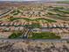 Aerial view of a desert golf course community with winding roads and homes at 1223 Golf Club Dr, Laughlin, NV 89029