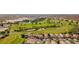 Aerial view of a golf course community featuring lush greenery and ponds at 1223 Golf Club Dr, Laughlin, NV 89029