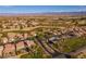 Aerial view of homes near a golf course surrounded by desert landscape and mountains at 1223 Golf Club Dr, Laughlin, NV 89029