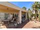 Charming covered patio with seating area and desert landscaping at 1223 Golf Club Dr, Laughlin, NV 89029