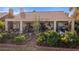 Serene backyard showcasing a covered patio, stylish furniture, and flourishing plants, creating an inviting ambiance at 1223 Golf Club Dr, Laughlin, NV 89029