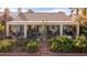 Picturesque backyard boasting a covered patio, cozy seating, and blooming flowers, ideal for enjoying the outdoors at 1223 Golf Club Dr, Laughlin, NV 89029