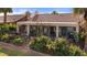 Delightful backyard with a covered patio, outdoor furniture, and beautiful landscaping, offering a private retreat at 1223 Golf Club Dr, Laughlin, NV 89029