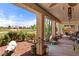 Lush backyard with golf course view, showcasing desert landscaping, cacti, and blooming rose bushes at 1223 Golf Club Dr, Laughlin, NV 89029
