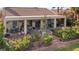 Inviting backyard featuring a covered patio, comfortable seating, and vibrant plants, perfect for relaxing and entertaining at 1223 Golf Club Dr, Laughlin, NV 89029