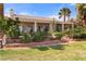 Landscaped backyard with a covered patio and views of the golf course at 1223 Golf Club Dr, Laughlin, NV 89029
