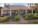 Lovely backyard highlighting a covered patio, comfortable chairs, and vibrant foliage, providing a tranquil setting at 1223 Golf Club Dr, Laughlin, NV 89029