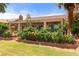 Backyard features a covered patio, desert landscaping, and easy access to the green at 1223 Golf Club Dr, Laughlin, NV 89029