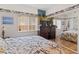 Cozy bedroom with a mirrored closet, natural light, and neutral tones creating a serene and comfortable space at 1223 Golf Club Dr, Laughlin, NV 89029