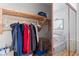 Organized walk-in closet with built-in wooden shelves and hanging rods, providing ample storage space at 1223 Golf Club Dr, Laughlin, NV 89029