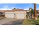 Charming single-story home features a two-car garage, tile roof, and an inviting gated front entryway at 1223 Golf Club Dr, Laughlin, NV 89029