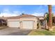 Charming single-story home features a two-car garage, tile roof, and an inviting gated front entryway at 1223 Golf Club Dr, Laughlin, NV 89029
