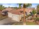 Expansive home featuring a two-car garage, tile roof, desert landscaping, and a private gated entrance at 1223 Golf Club Dr, Laughlin, NV 89029